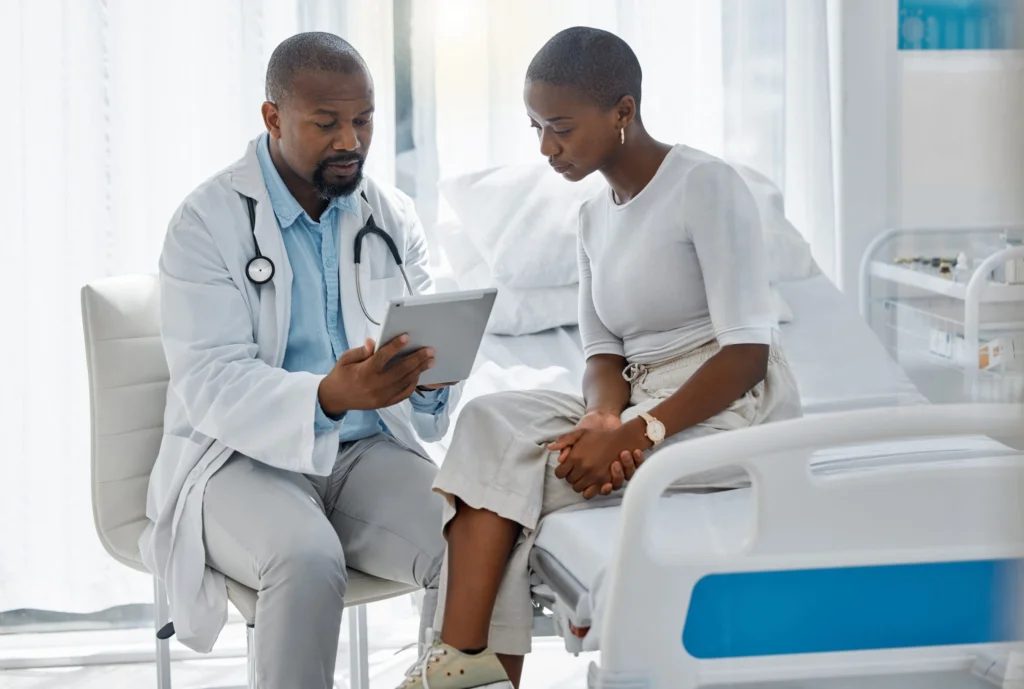 A physician reviewing results with a patient.